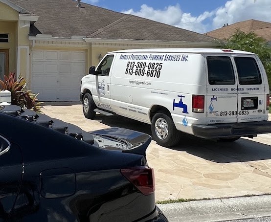 Harold's Professional Plumbing Services work van parked at a customer's home